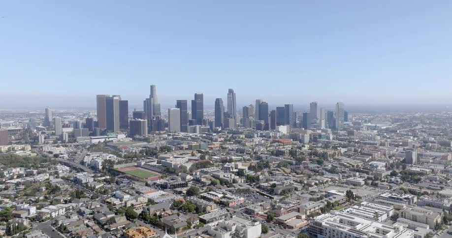 Aerial panorama of a metropolis against a blue sky