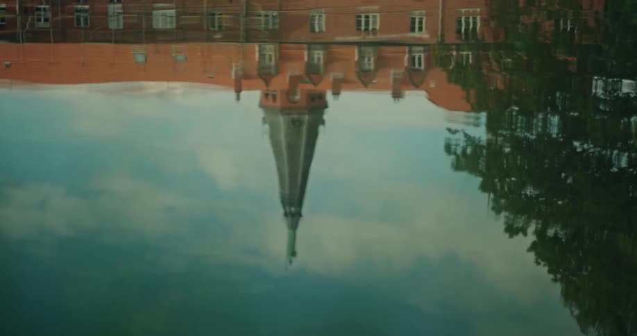 Lake reflecting a a church spire