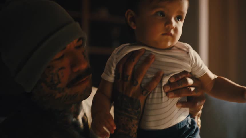 Man holding his little son