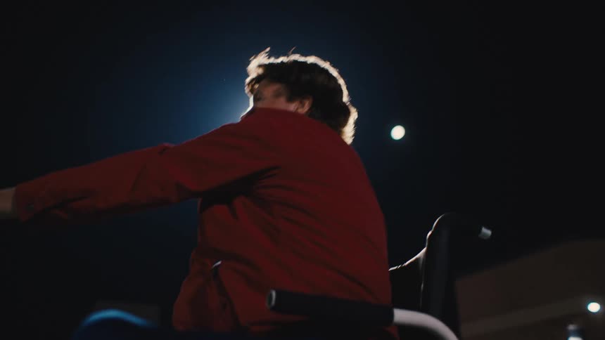 Person sitting holding a football