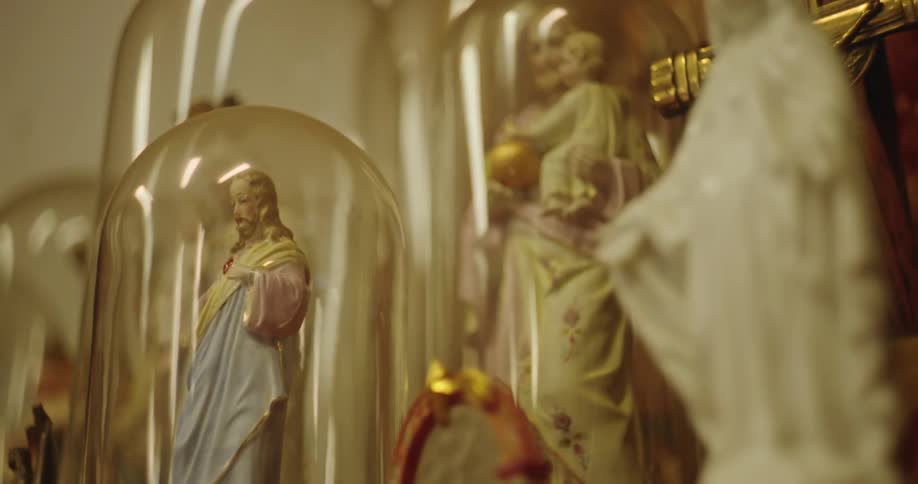 Religious plaster dolls in glass