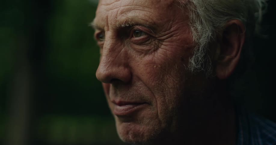 Close up of the face of an elderly man standing outdoors
