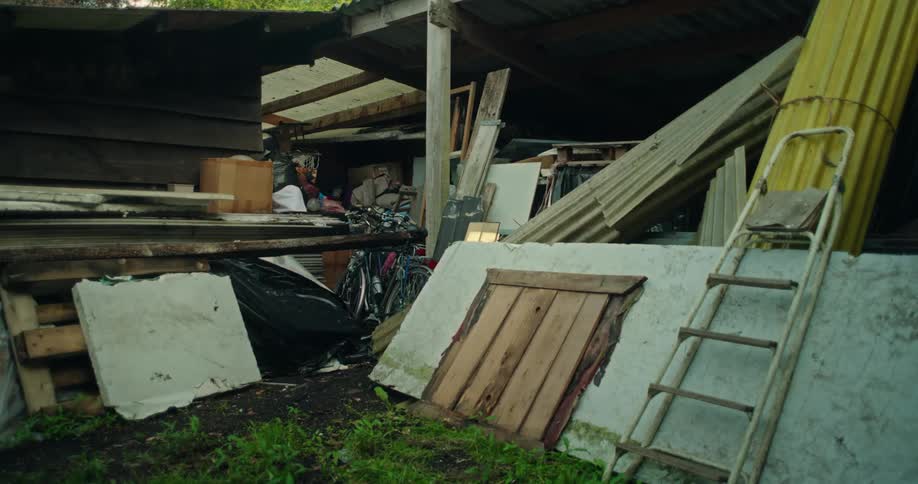Shed site with wood and metal debris
