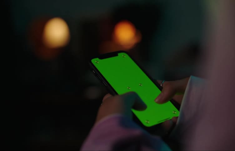 Close up of a person typing on their cell phone