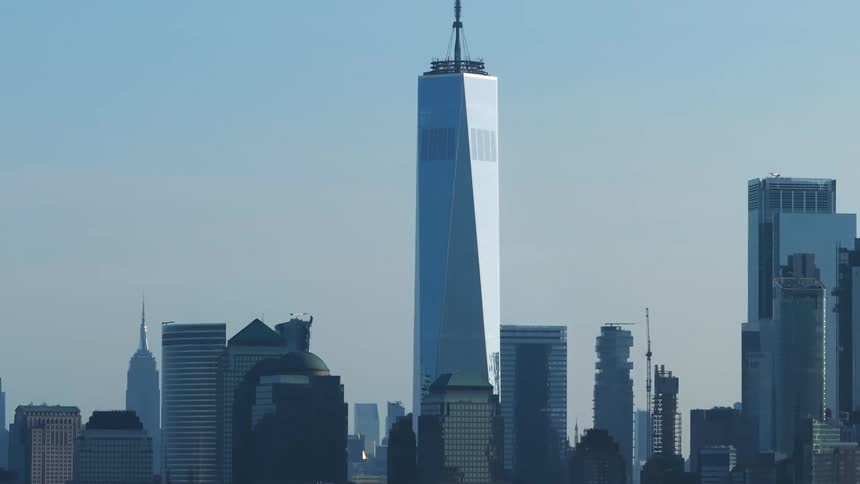 A cityscape with the iconic one world trade center in the center