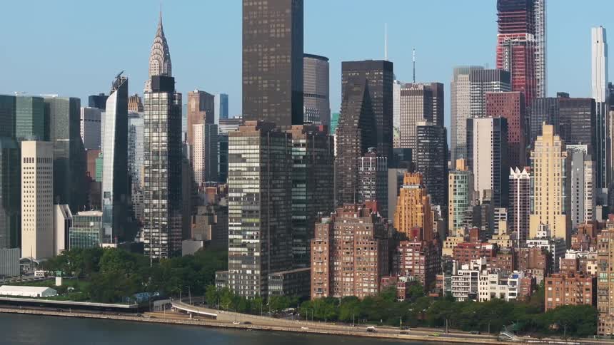 A dense cityscape new york city with a mix of skyscrapers residential buildings and green spaces