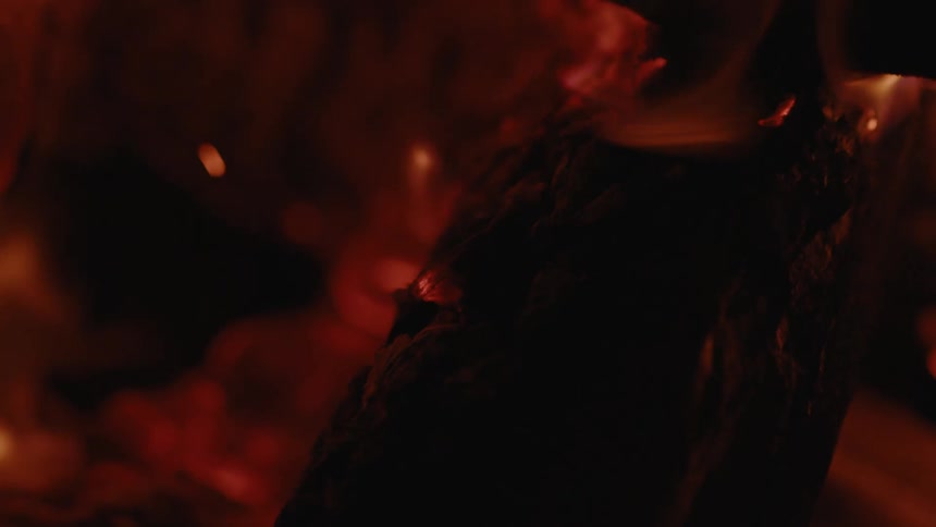 Wooden logs burning in a fire