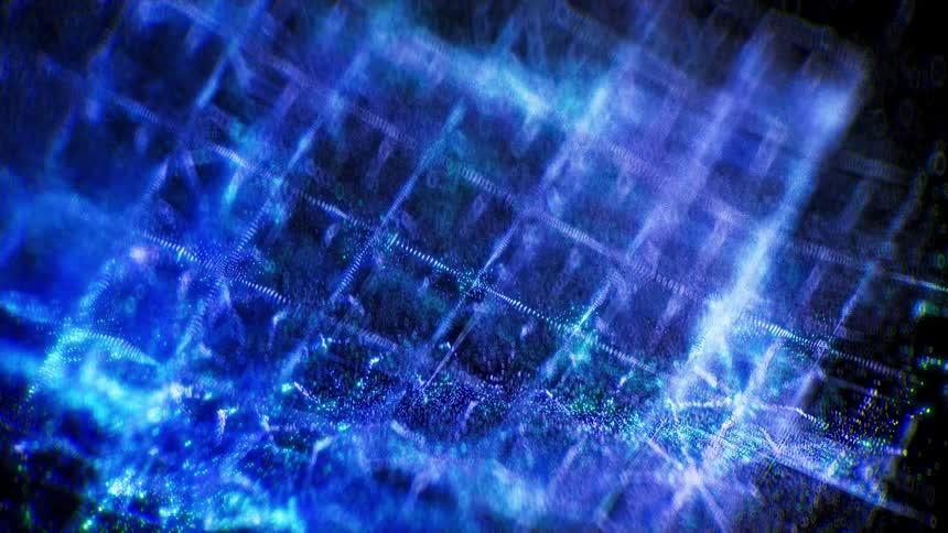 Close up of an electric blue intricate geometric pattern waving against a dark background