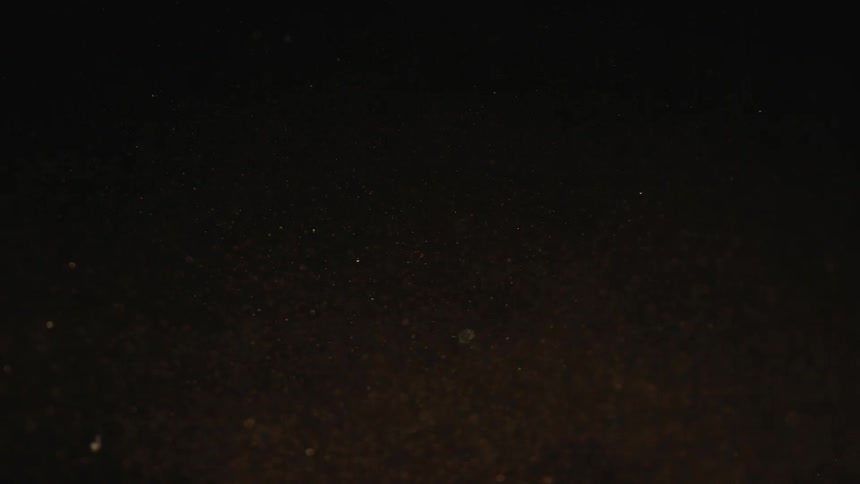 Abstract powder texture against a black background in fall