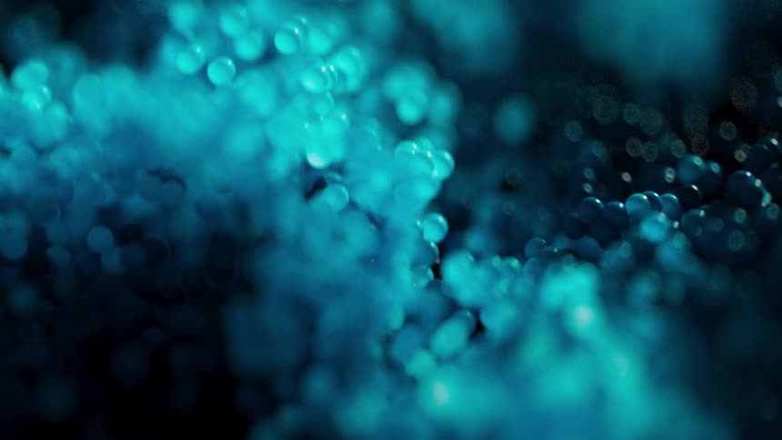 Blue bubbles flow upwards in a liquid medium