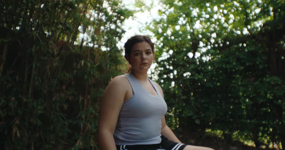 A girl is posing in the wheelchair