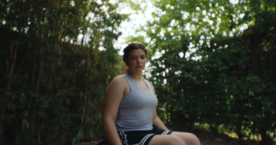 A girl is sitting in a wheelchair