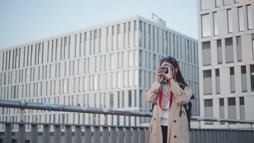 A tourist is taking pictures in the city