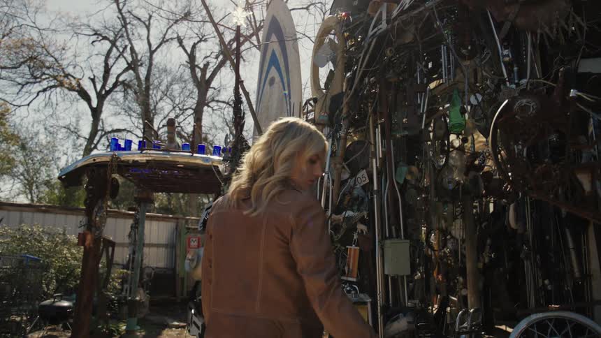 A clip of a female assessing a scrap store