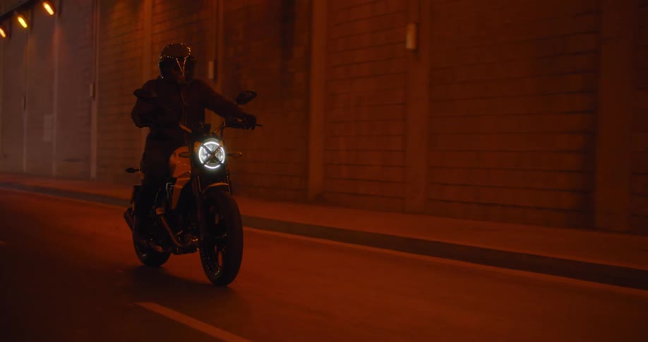 A clip of a biker riding in the night