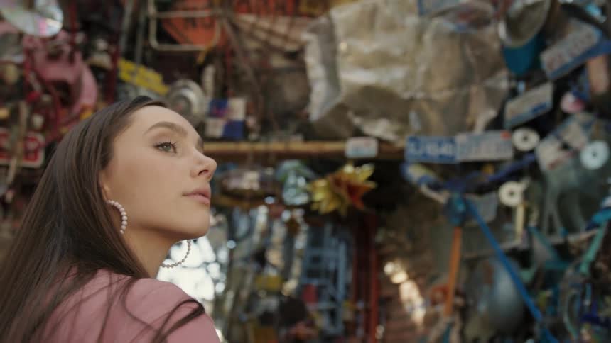 A clip of a female in looking around the scrap store