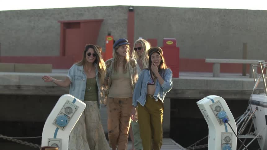 A group of friends walk and talk