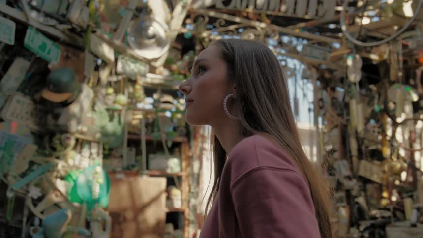 A clip of a blonde female in a scrap store