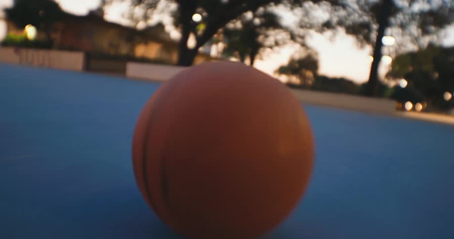 A close up clip of a basketball rolling