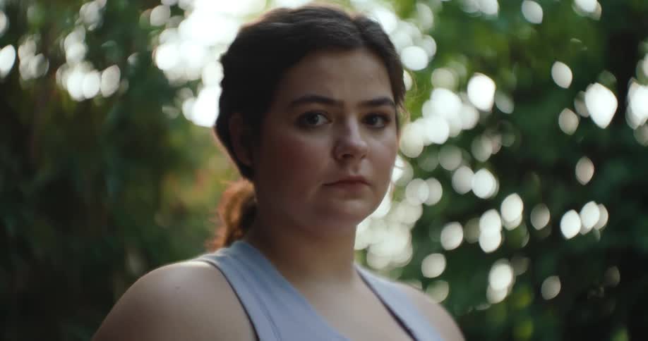 The face of a young woman who is staring straight ahead