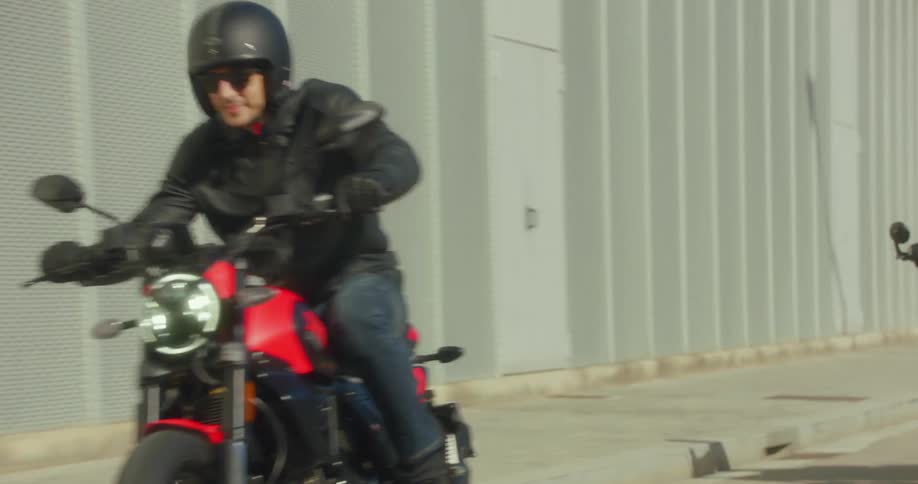 Three bikers riding their motorcycles on a city road