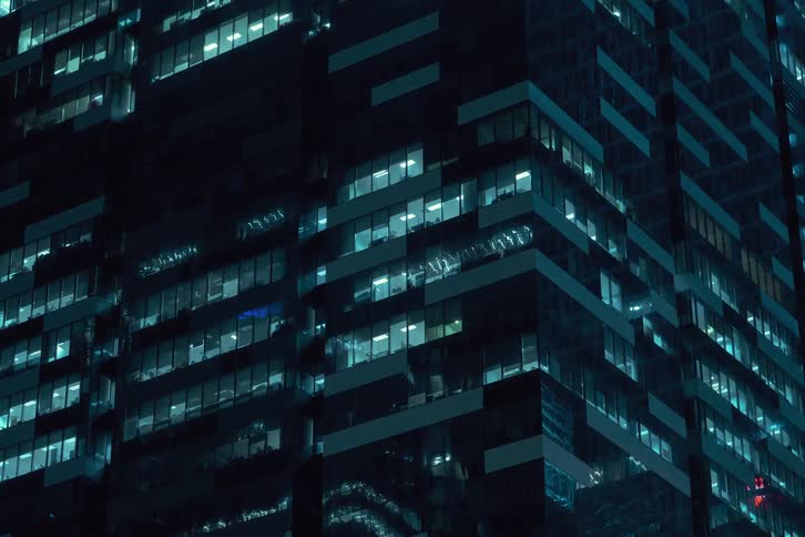 A time lapse of office building lights flashing