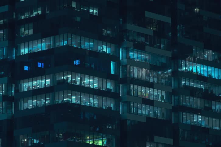 A time lapse of office workers working through the night at high speed