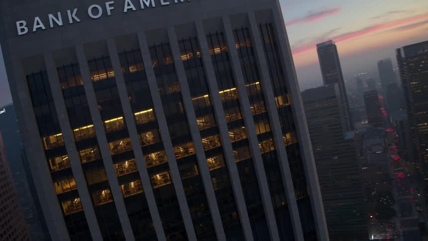 An aerial view of a skyscraper in the city during twilight