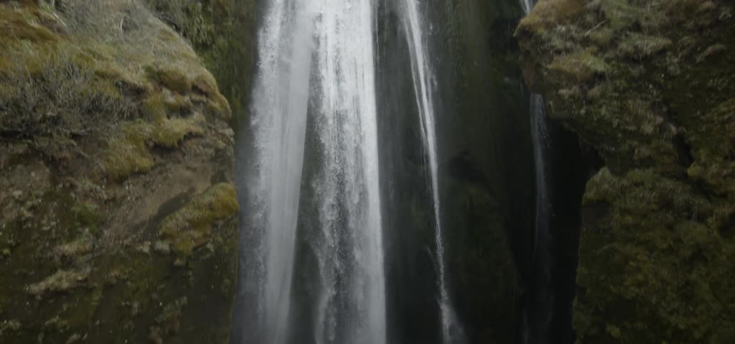 Very high waterfalls flowing into the basin below it