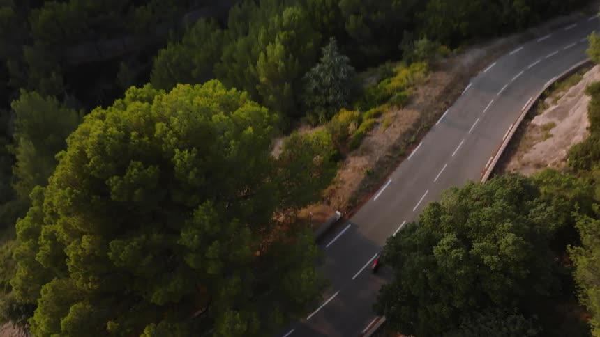 An aerial clip of a freeway in the forest