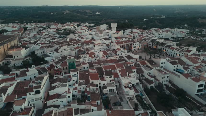 Aerial of housing rooftops condensed in a city