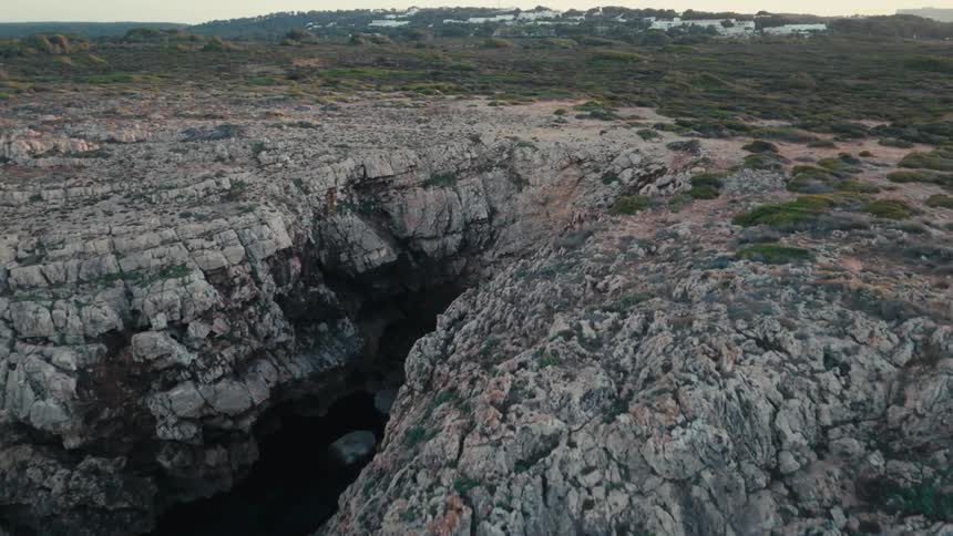 An aerial clip of a rocky hill