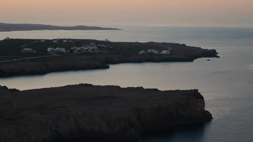 A rural community sits on a promontory by the ocean