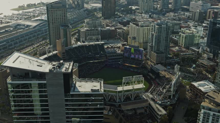 An aerial view of a stadium in the heart of a city