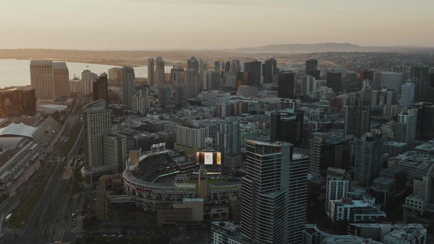 A center of a metropolitan city with several tall buildings close to the sea