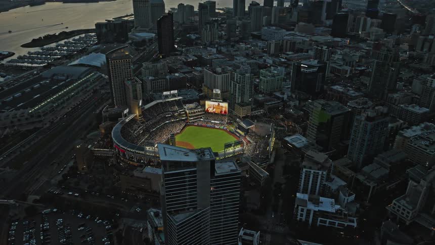 An evening shot of a stadium in a metropolitan city