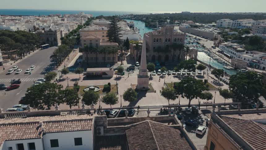 Aerial of a town square in a coastal city on a sunny day