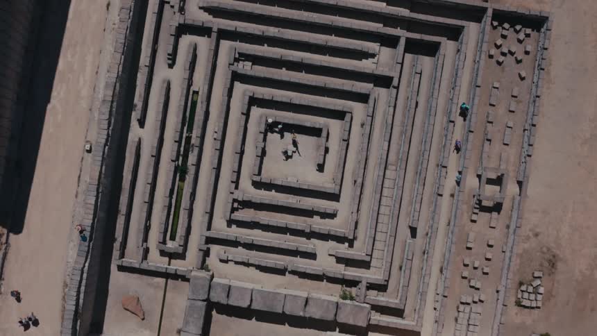 People travel through the large stone maze