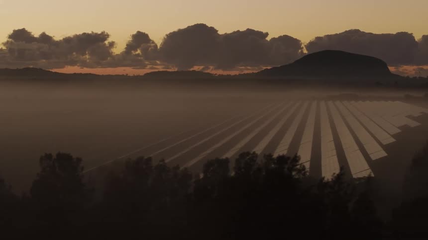 Fog covers the solar farm