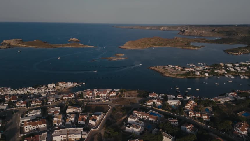 The homes are near the blue water of the peninsula