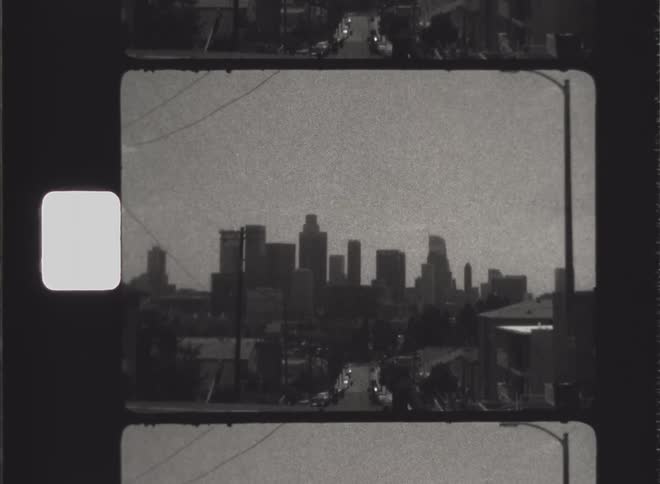 Down the road is a skyline of large towers