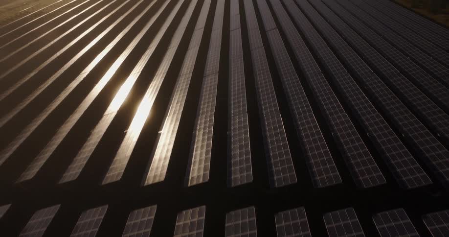 The sunlight reflects on the solar panels