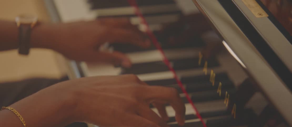 A close up clip of a person playing keyboard