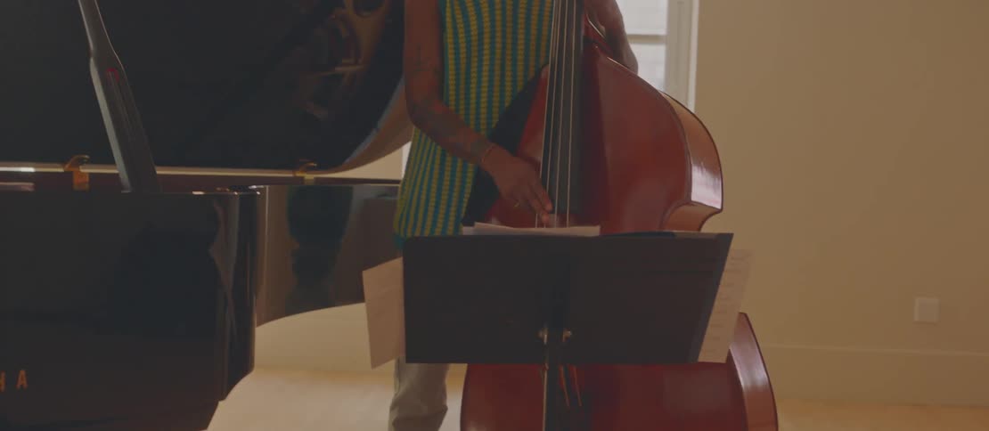 Two men and a musical rehearsal with one of them playing the piano and the other with a guitar