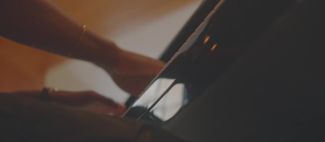 A pair of hands playing piano