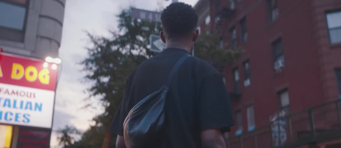 Man crossing the street in a city