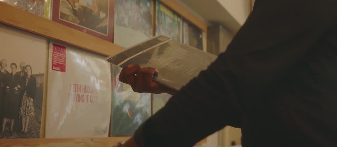 Man looking at vinyl records in a store