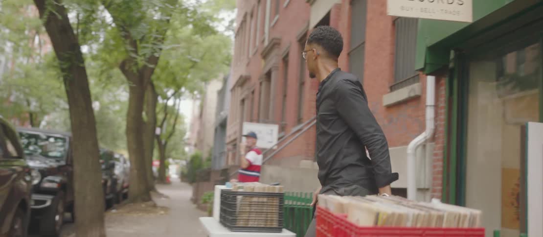 Customer walks out of a store that sells vinyl records