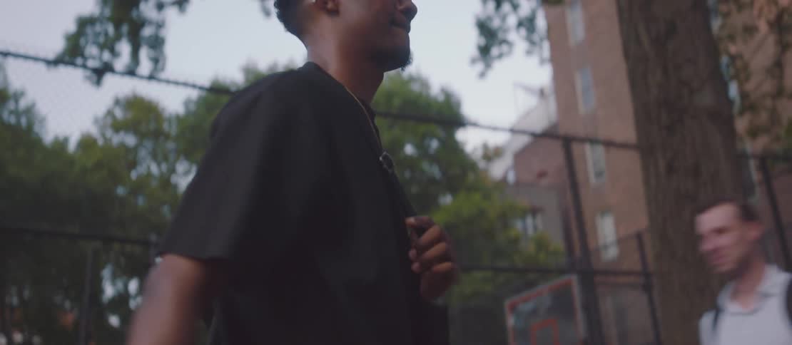 Smiling man walking through the streets of a city