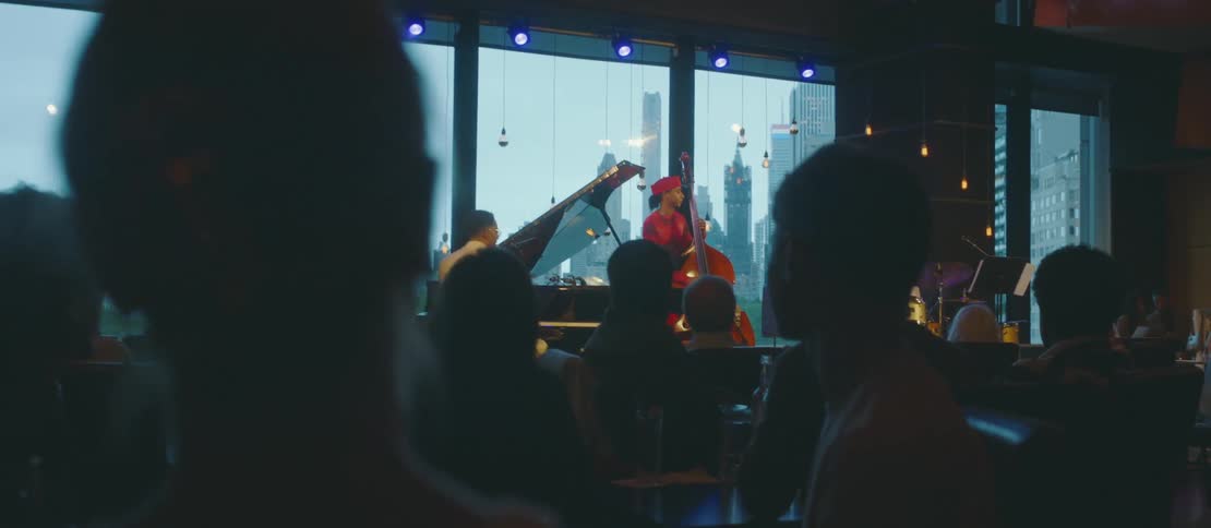 Group of people sitting and enjoying a musical group
